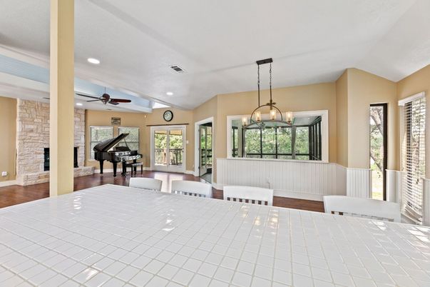 Dining room, Interior, Pendant Lights, Piano, Recessed Lighting, Stone Walls, Wood Texture Flooring