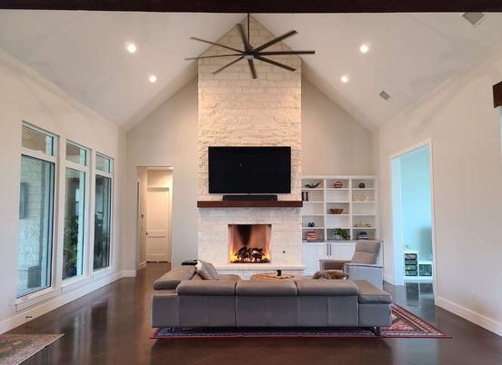 Fireplace, Interior, Living room, Recessed Lighting, Stone Walls, Wood Texture Flooring