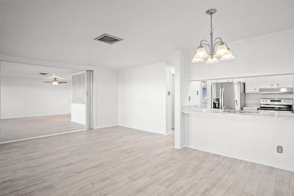 Chandelier, Empty room, Interior, Kitchen, Stainless Steel Appliances, Wood Texture Flooring