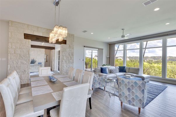 Chandelier, Dining room, Interior, Living room, Pendant Lights, Recessed Lighting, Stone Walls, Wood Texture Flooring