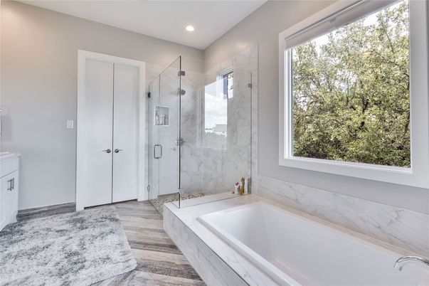Bathroom, Glass Shower, Interior, Marble Walls, Recessed Lighting, Wood Texture Flooring