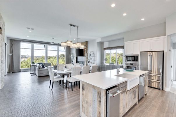 Chandelier, Dining room, Interior, Kitchen, Living room, Pendant Lights, Recessed Lighting, Stainless Steel Appliances, Wood Texture Flooring