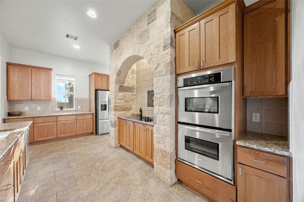 Interior, Kitchen, Recessed Lighting, Stainless Steel Appliances, Stone Walls