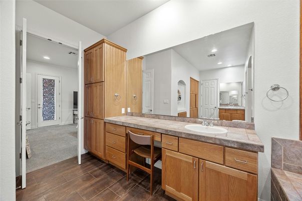 Bathroom, Dual Sink Vanities, Interior, Recessed Lighting, Tile Countertops, Wood Texture Flooring