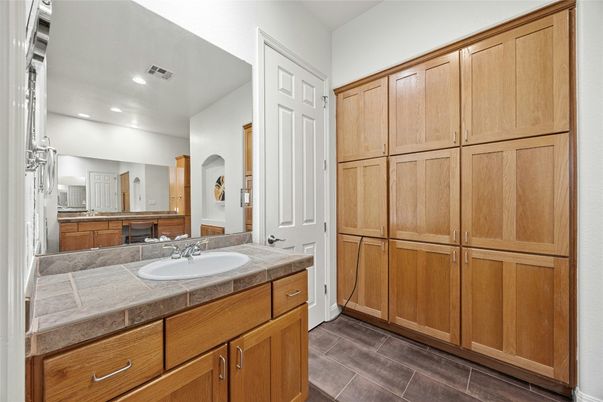 Bathroom, Dual Sink Vanities, Interior, Recessed Lighting, Tile Countertops