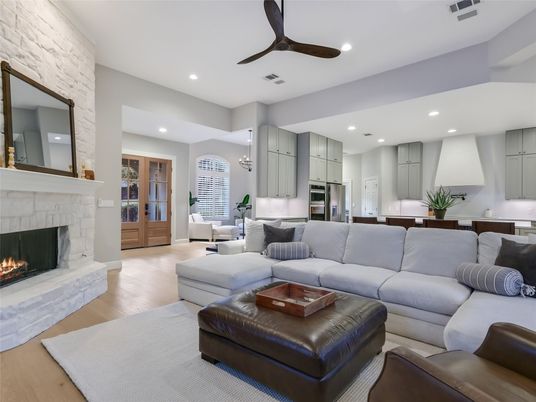 Fireplace, Interior, Kitchen, Living room, Pendant Lights, Recessed Lighting, Stainless Steel Appliances, Stone Walls, Wood Texture Flooring