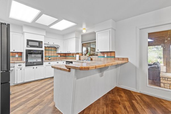 Interior, Kitchen, Tile Countertops, Wood Texture Flooring