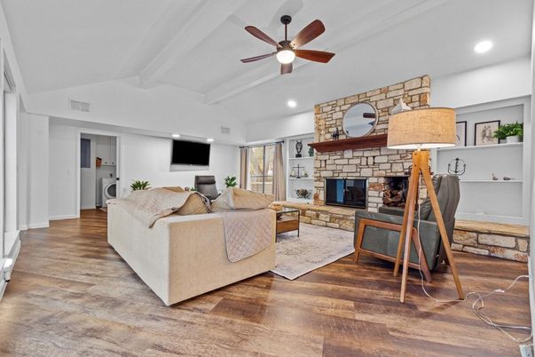 Fireplace, Interior, Living room, Recessed Lighting, Stone Walls, Wood Texture Flooring