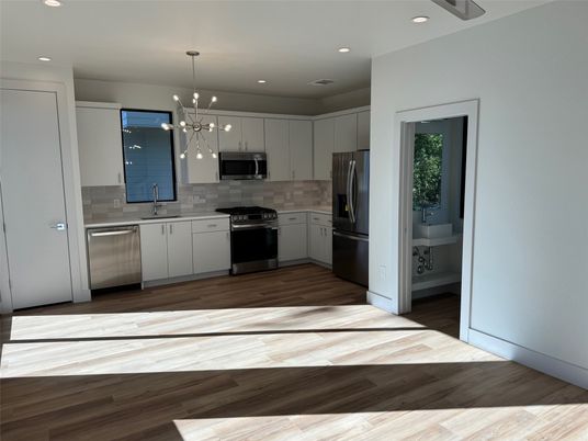 Interior, Kitchen, Pendant Lights, Recessed Lighting, Stainless Steel Appliances, Wood Texture Flooring