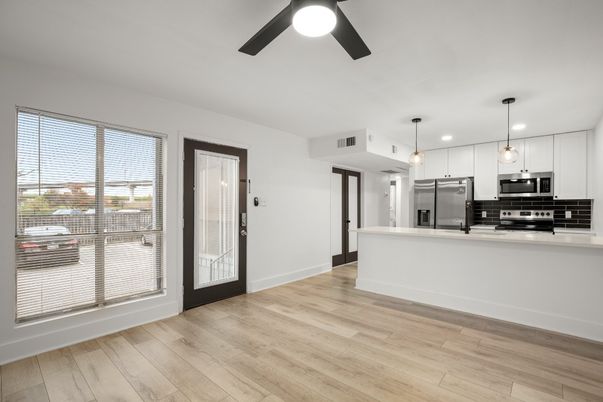 Empty room, Interior, Kitchen, Pendant Lights, Stainless Steel Appliances, Wood Texture Flooring