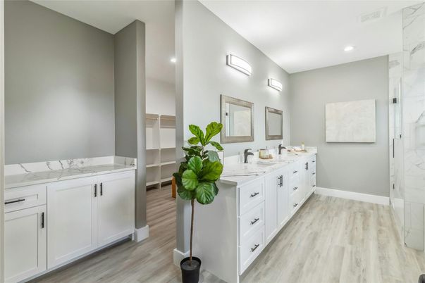 Bathroom, Dual Sink Vanities, Interior, Marble Walls, Recessed Lighting, Wood Texture Flooring