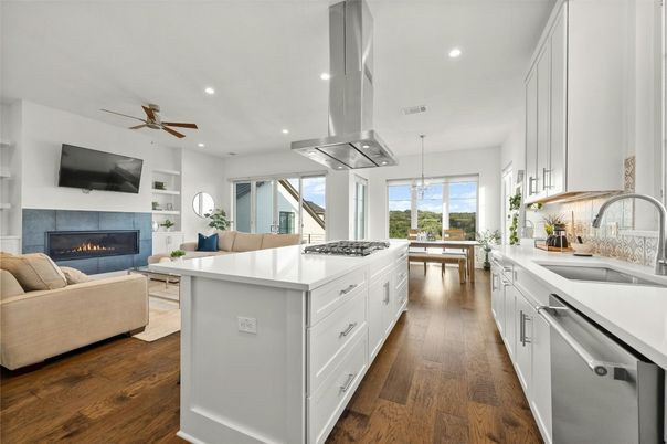 Dining room, Fireplace, Interior, Kitchen, Living room, Pendant Lights, Recessed Lighting, Stainless Steel Appliances, Wood Texture Flooring
