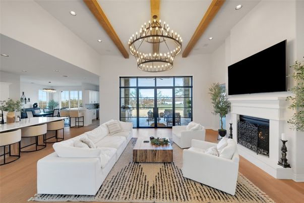 Chandelier, Dining room, Fireplace, Interior, Living room, Pendant Lights, Recessed Lighting, Wooden Beams, Wood Texture Flooring