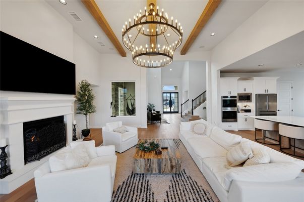 Chandelier, Dining room, Fireplace, Interior, Kitchen, Living room, Pendant Lights, Recessed Lighting, Stainless Steel Appliances, Wooden Beams, Wood Texture Flooring