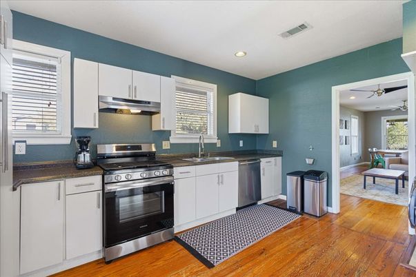Dining room, Interior, Kitchen, Recessed Lighting, Stainless Steel Appliances, Wood Texture Flooring