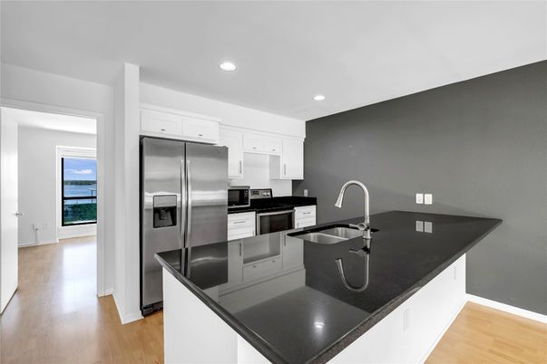 Interior, Kitchen, Recessed Lighting, Stainless Steel Appliances, Water, Wood Texture Flooring