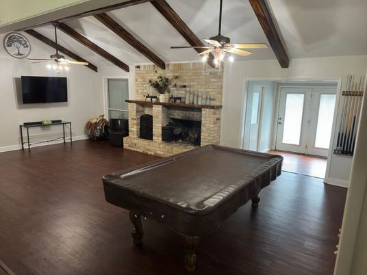 Billiard Table, Fireplace, Game Room, Interior, Stone Walls, Wooden Beams, Wood Texture Flooring