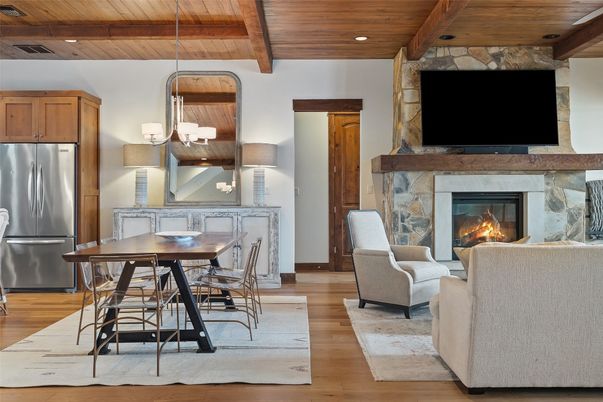 Dining room, Fireplace, Interior, Kitchen, Living room, Pendant Lights, Recessed Lighting, Stainless Steel Appliances, Stone Walls, Wooden Beams, Wooden Ceilings, Wood Texture Flooring