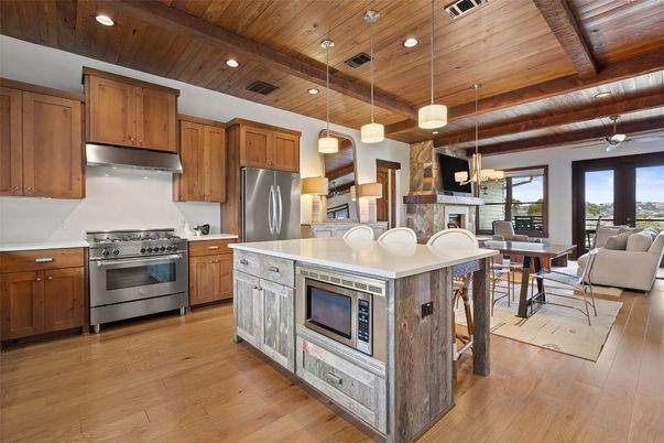 Dining room, Interior, Kitchen, Living room, Pendant Lights, Recessed Lighting, Stainless Steel Appliances, Wooden Beams, Wooden Ceilings, Wood Texture Flooring
