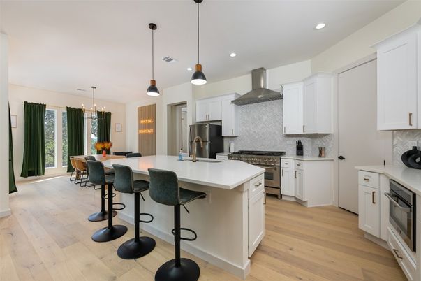 Dining room, Interior, Kitchen, Pendant Lights, Recessed Lighting, Stainless Steel Appliances, Wood Texture Flooring