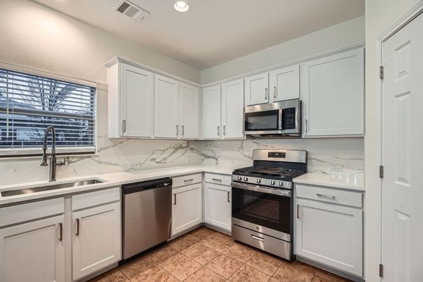 Interior, Kitchen, Marble Walls, Recessed Lighting, Stainless Steel Appliances