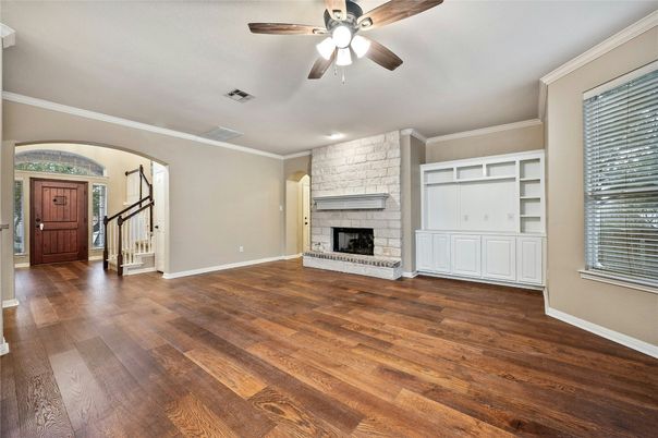 Empty room, Fireplace, Interior, Recessed Lighting, Stone Walls, Wood Texture Flooring