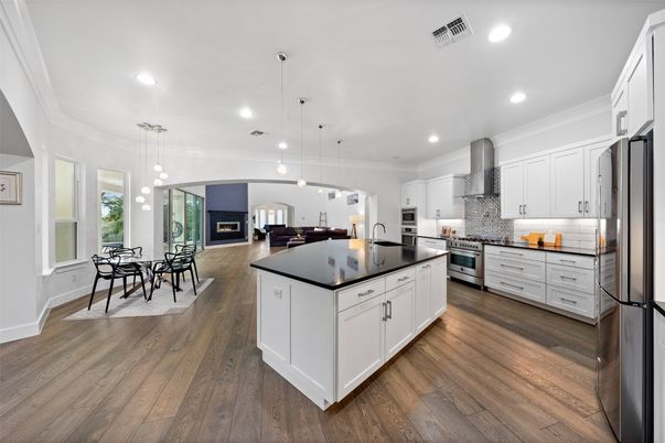 Dining room, Interior, Kitchen, Pendant Lights, Recessed Lighting, Stainless Steel Appliances, Wood Texture Flooring