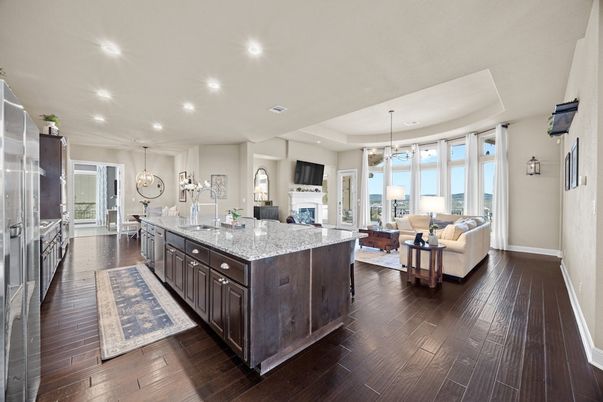 Dining room, Fireplace, Interior, Kitchen, Living room, Pendant Lights, Recessed Lighting, Stainless Steel Appliances, Wood Texture Flooring