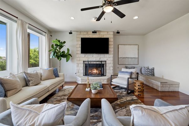 Fireplace, Interior, Living room, Recessed Lighting, Stone Walls, Wood Texture Flooring