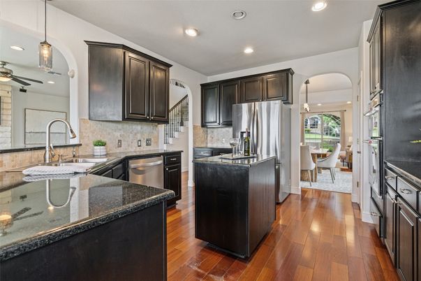 Dining room, Interior, Kitchen, Pendant Lights, Recessed Lighting, Stainless Steel Appliances, Wood Texture Flooring