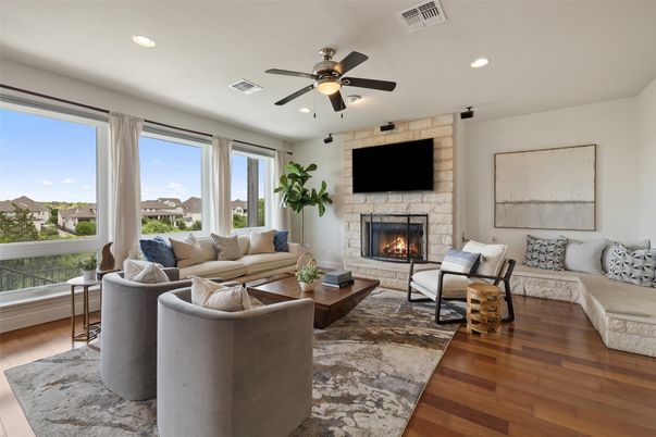 Fireplace, Interior, Living room, Recessed Lighting, Stone Walls, Wood Texture Flooring