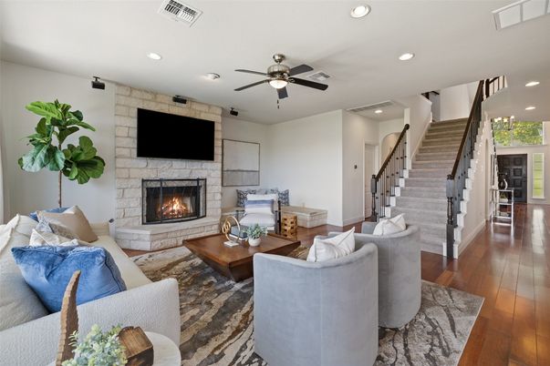Fireplace, Interior, Living room, Recessed Lighting, Stone Walls, Wood Texture Flooring
