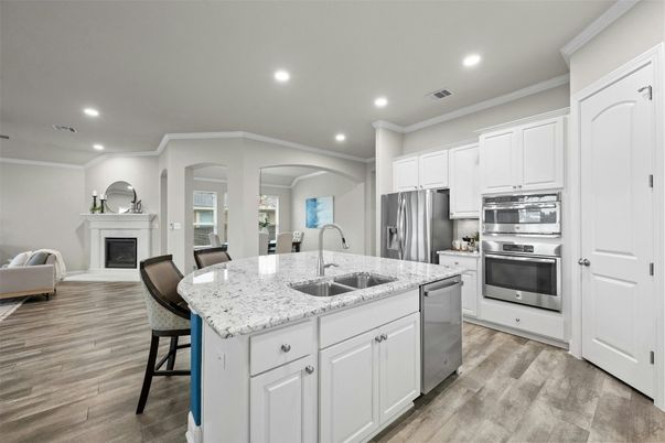 Fireplace, Interior, Kitchen, Recessed Lighting, Stainless Steel Appliances, Wood Texture Flooring