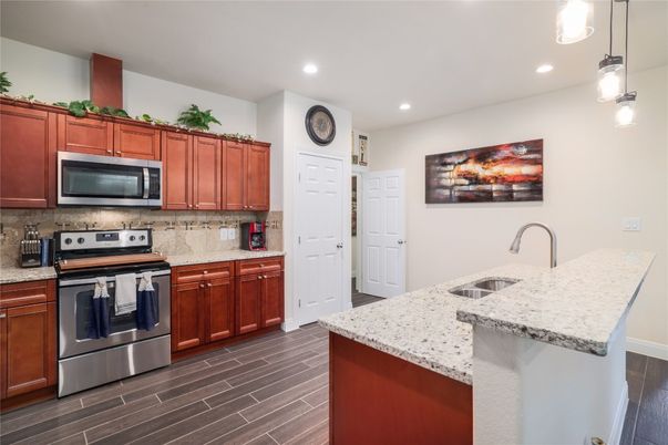 Interior, Kitchen, Pendant Lights, Recessed Lighting, Stainless Steel Appliances, Wood Texture Flooring