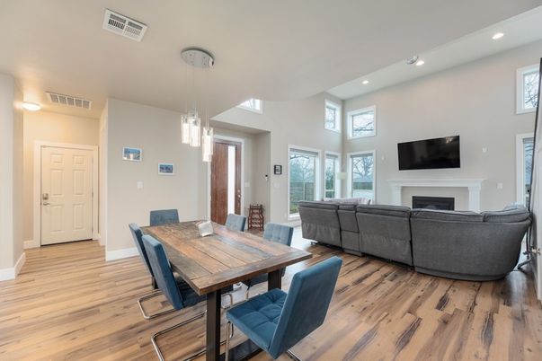 Dining room, Fireplace, Interior, Living room, Pendant Lights, Recessed Lighting, Wood Texture Flooring