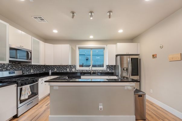 Interior, Kitchen, Recessed Lighting, Stainless Steel Appliances, Wood Texture Flooring