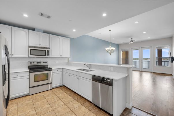 Chandelier, Interior, Kitchen, Recessed Lighting, Stainless Steel Appliances, Wood Texture Flooring