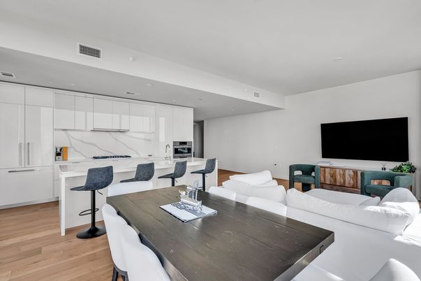 Dining room, Interior, Kitchen, Living room, Marble Walls, Recessed Lighting, Stainless Steel Appliances, Wood Texture Flooring