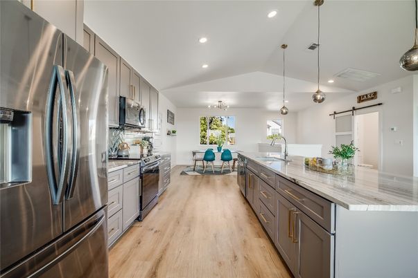 Dining room, Interior, Kitchen, Pendant Lights, Recessed Lighting, Stainless Steel Appliances, Wood Texture Flooring