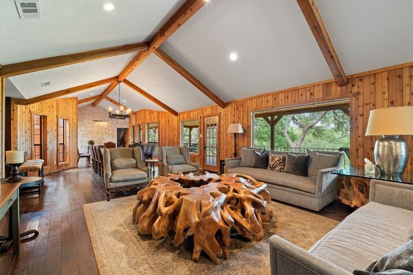 Chandelier, Dining room, Fireplace, Interior, Living room, Recessed Lighting, Stone Walls, Wooden Beams, Wood Texture Flooring, Wooden Walls