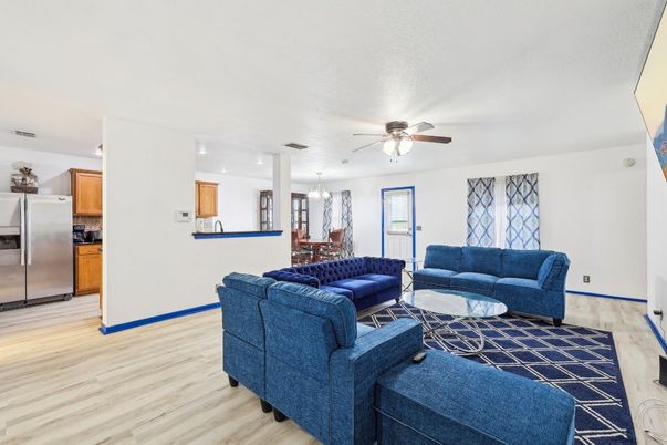 Chandelier, Dining room, Interior, Kitchen, Living room, Recessed Lighting, Stainless Steel Appliances, Wood Texture Flooring