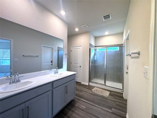 Bathroom, Dual Sink Vanities, Glass Shower, Interior, Recessed Lighting, Wood Texture Flooring