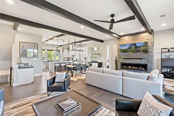 Dining room, Fireplace, Interior, Kitchen, Living room, Pendant Lights, Recessed Lighting, Stainless Steel Appliances, Stone Walls, Wood Texture Flooring