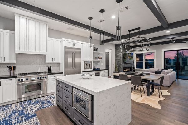 Dining room, Fireplace, Interior, Kitchen, Living room, Pendant Lights, Recessed Lighting, Stainless Steel Appliances, Stone Walls, Wooden Beams, Wood Texture Flooring
