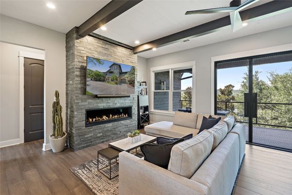 Fireplace, Interior, Living room, Recessed Lighting, Stone Walls, Wood Texture Flooring
