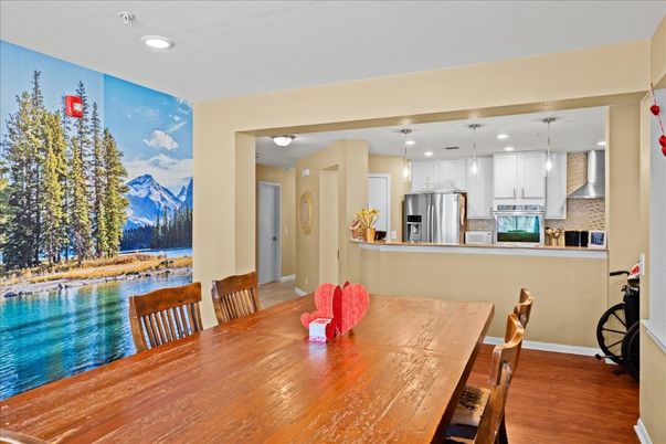 Dining room, Interior, Kitchen, Pendant Lights, Recessed Lighting, Stainless Steel Appliances, Wood Texture Flooring
