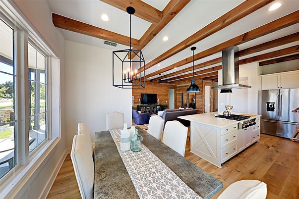 Dining room, Interior, Kitchen, Living room, Pendant Lights, Recessed Lighting, Stainless Steel Appliances, Stone Walls, Wooden Beams, Wood Texture Flooring