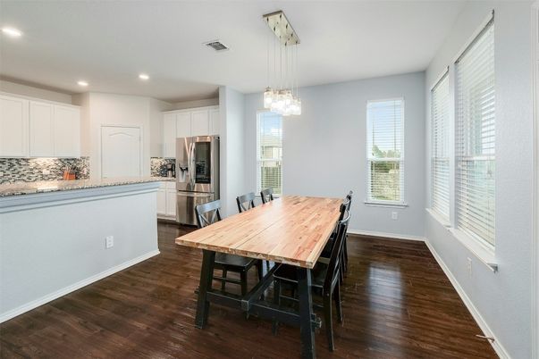 Dining room, Interior, Kitchen, Pendant Lights, Recessed Lighting, Stainless Steel Appliances, Wood Texture Flooring