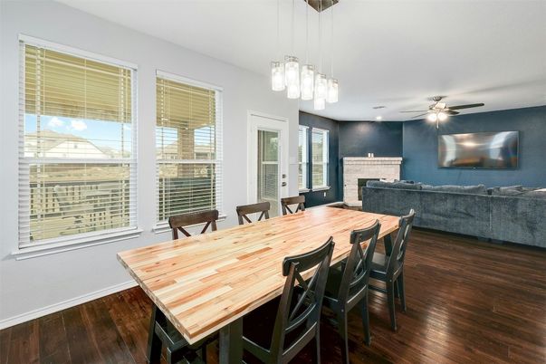 Dining room, Fireplace, Interior, Living room, Pendant Lights, Recessed Lighting, Wood Texture Flooring
