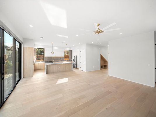 Empty room, Interior, Kitchen, Pendant Lights, Recessed Lighting, Stainless Steel Appliances, Wood Texture Flooring